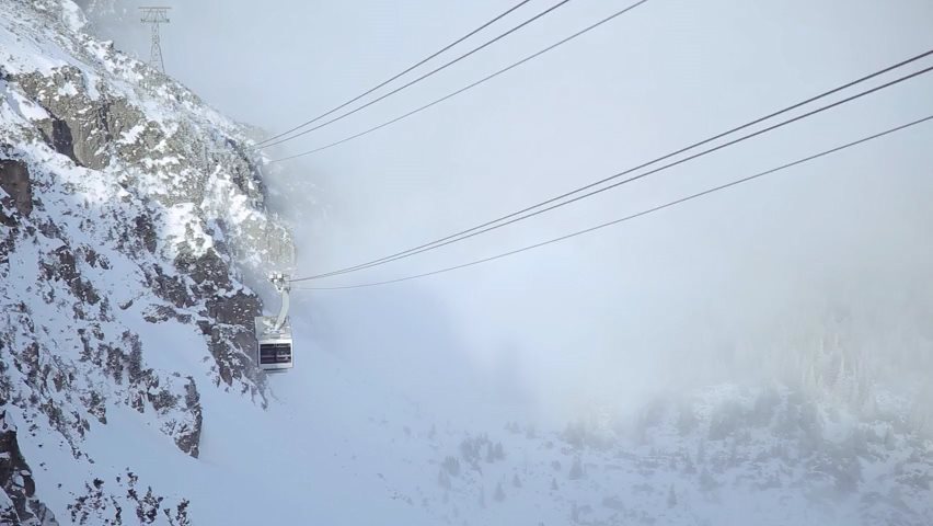 Video of ski gondola driving through mountain fog