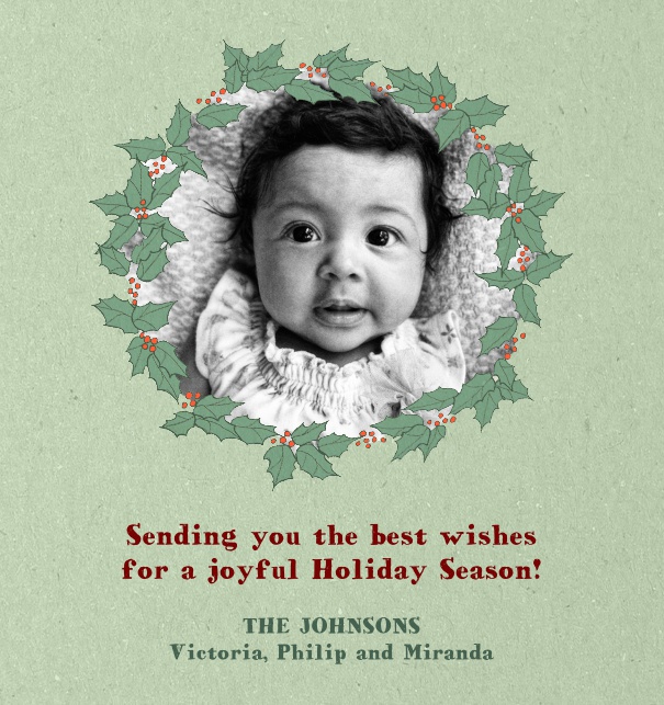 Hellgrüne Online Kartenvorlage für Weihnachtskarten mit Fotooption umrandet von einem Lorbeerenkranz und gestaltetem Text zum Anpassen.