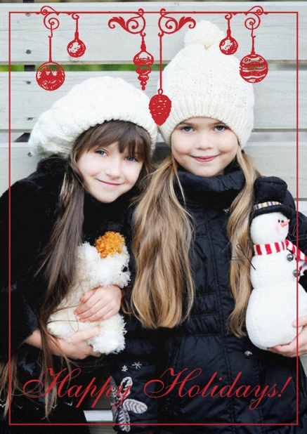 Christmas or Holiday card with red Christmas ball decoration over a photo field.