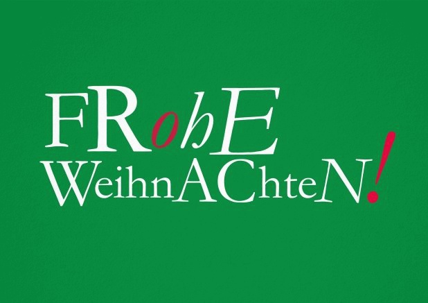 Grüne Weihnachtskarte mit der Aufschrift "Frohe Weihnachten!".