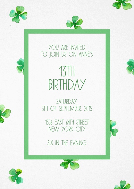 White invitation card with green frame and clovers