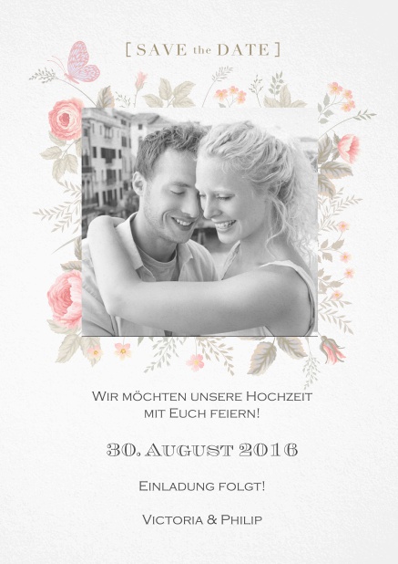 Save the Date Karte zur Hochzeit mit zarten Blumen um ein Foto.