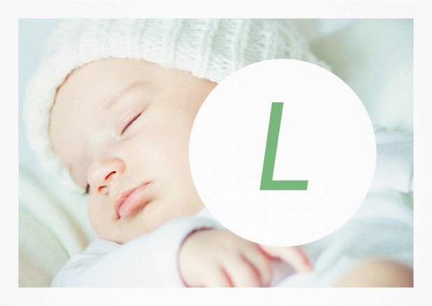 Birth announcement card with large photo and large editable letter, including editable text for announcing the new born. Green.
