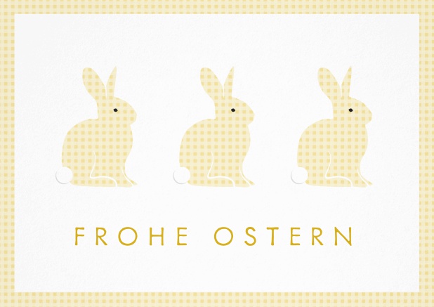 Frohe Ostern wünschen mit Osterkarte mit 3 süßen Osterhasen. Gelb.