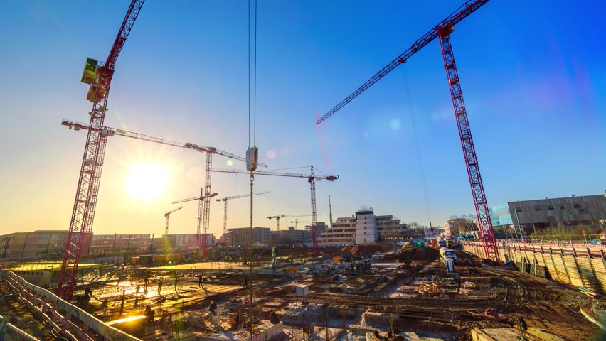 Video of a construction site with turning cranes