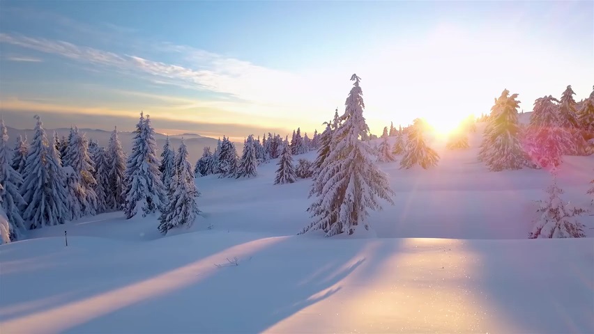 Video of beautiful snowy mountain landscape just before the sunset