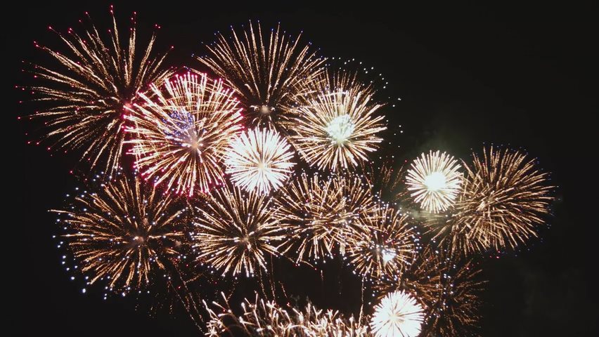 Video of white fireworks exploding in the sky