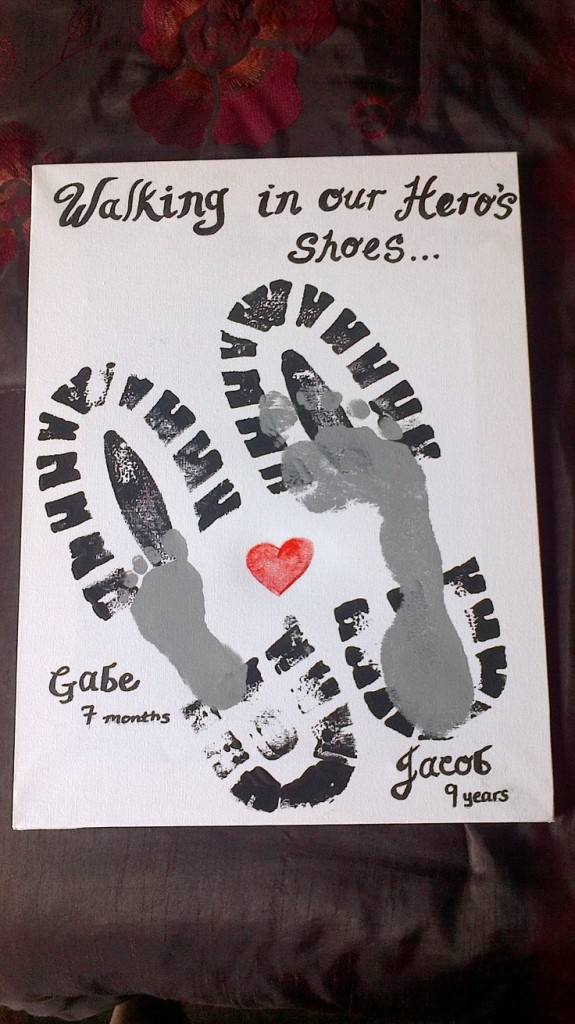 Footprint of father and son with heart and slogan "Walking in my Hero's shoes"