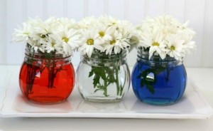 Three vases in blue, red, white