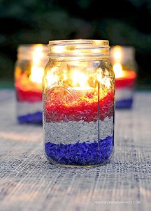 Three glasses with colored rice.